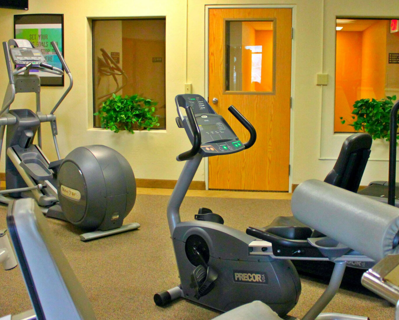 Modern fitness center at Broadway Inn with cardio and strength training equipment
