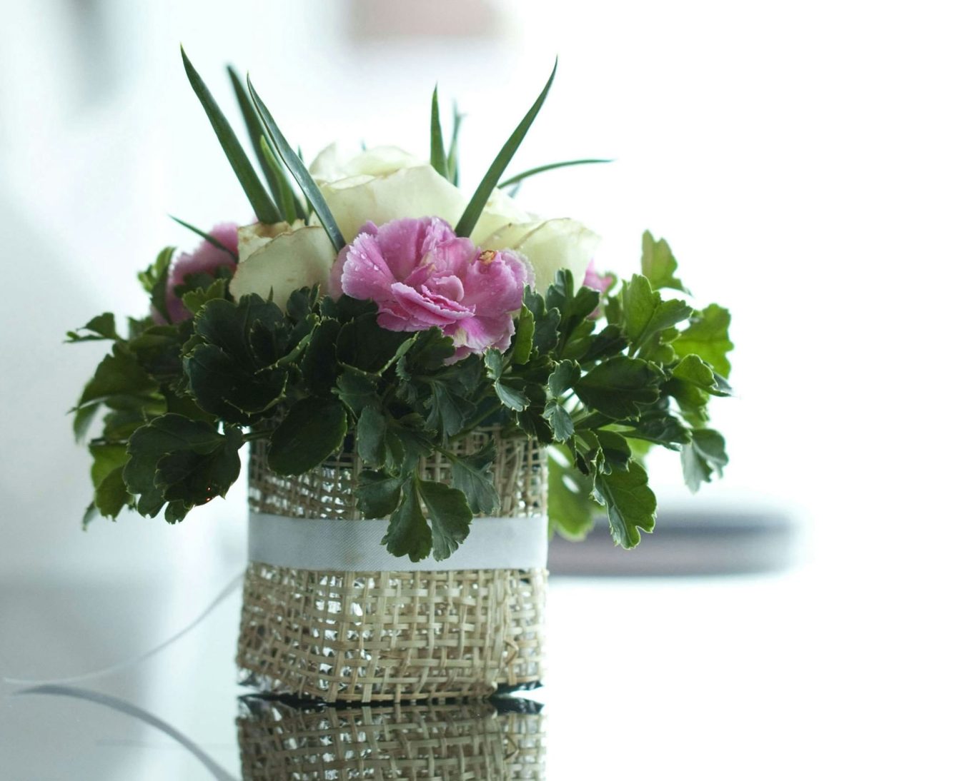 Floral centerpiece on table with natural light at Budget Inn Lynchburg Bedford