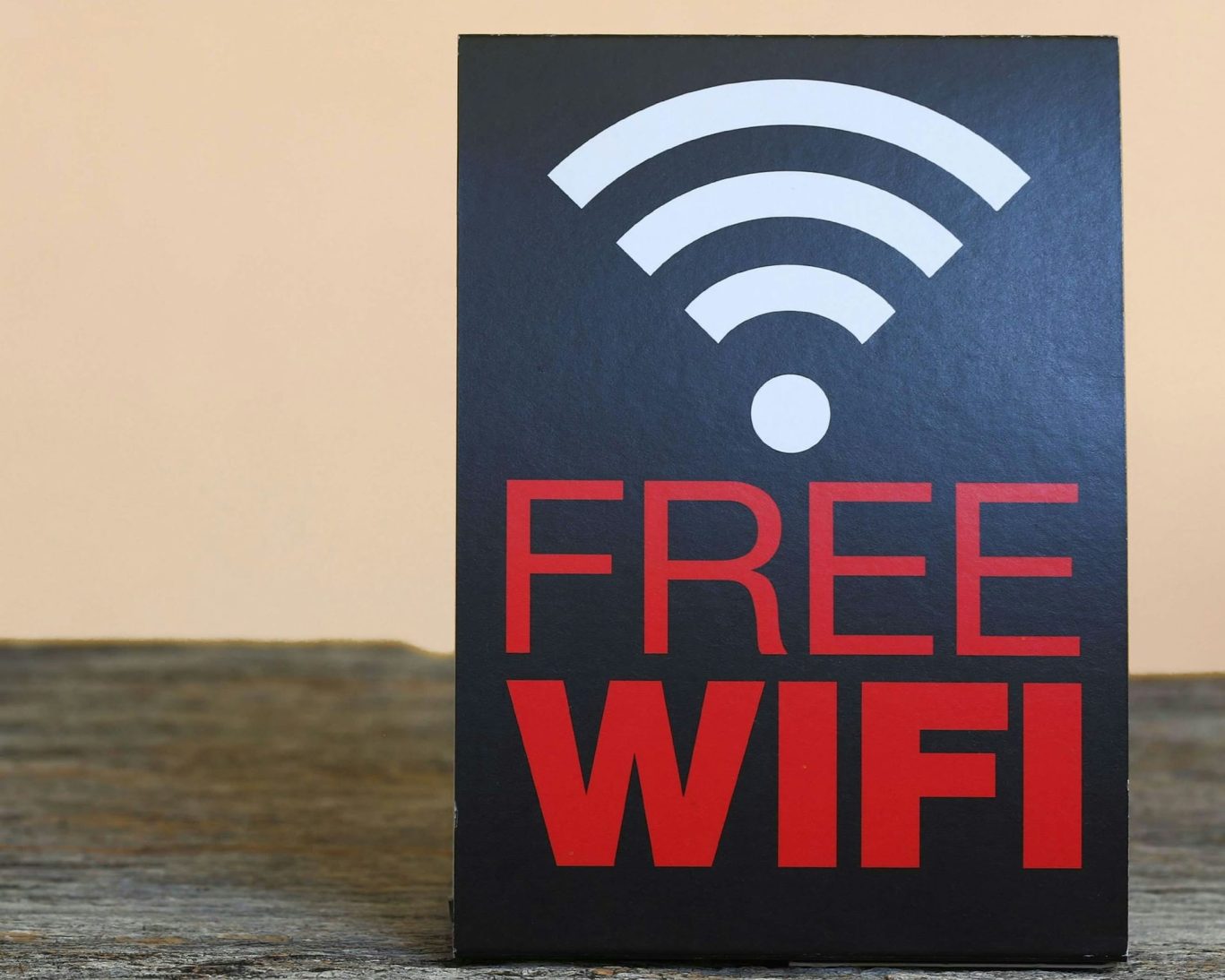 Sign displaying free Wi-Fi access at Dynasty Suites for guest convenience.