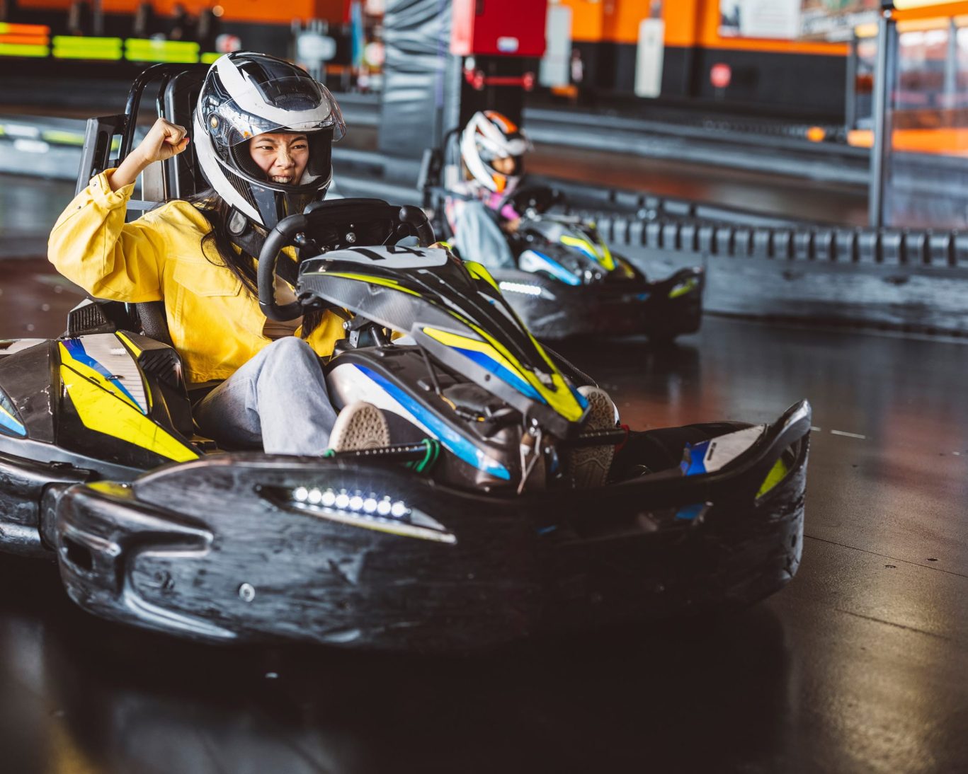 Indoor go-kart racing at MB2 Raceway near Economy Inn Sylmar, perfect for family fun and group activities.