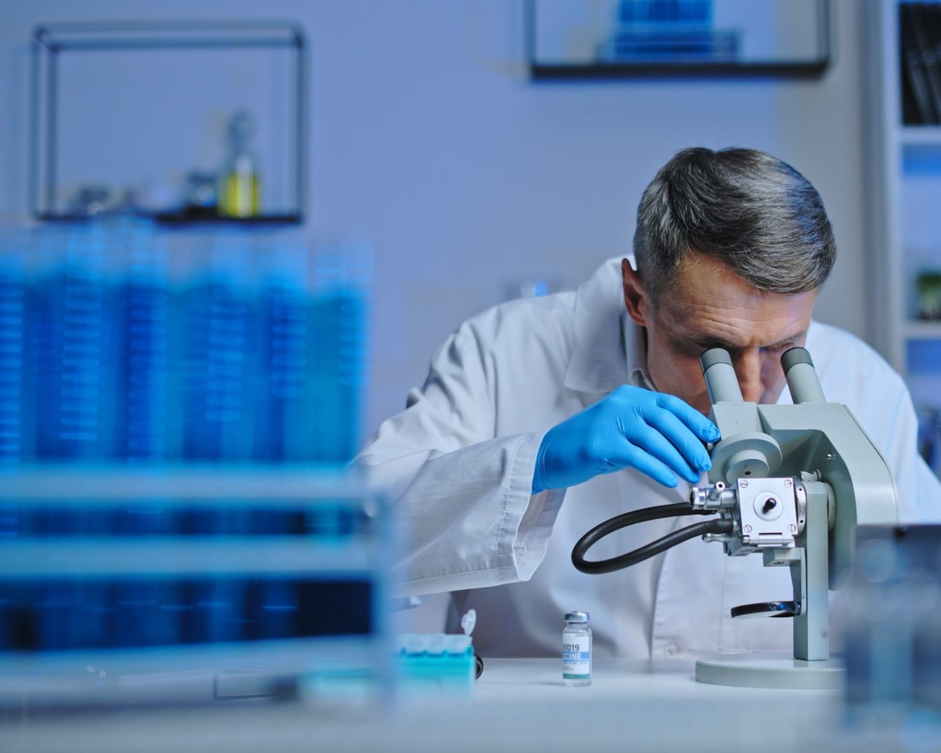 Scientist working under a microscope at Ecolab research facility near Escondido, CA.