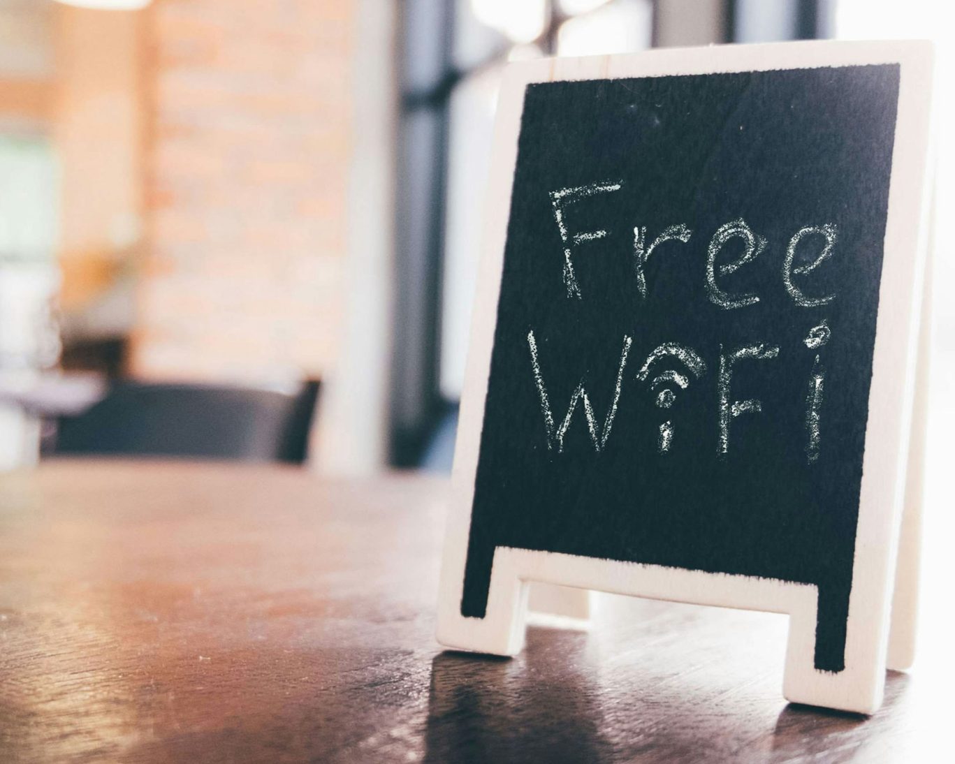 Chalkboard-style sign displaying free Wi-Fi available at Executive Inn & Suites for all guests.