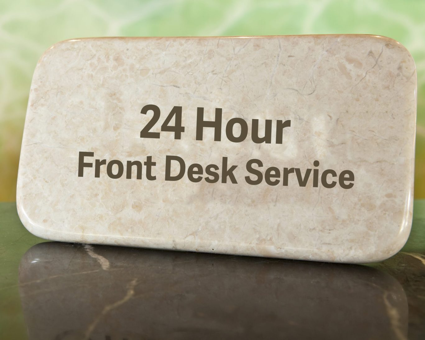 Marble sign indicating 24-hour front desk service at Express Inn Newport for guest assistance anytime.