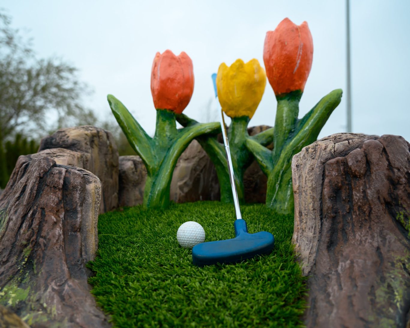 Mini golf putting green with tulip-themed decor, part of the family-friendly activities at Fountain Beach Resort.