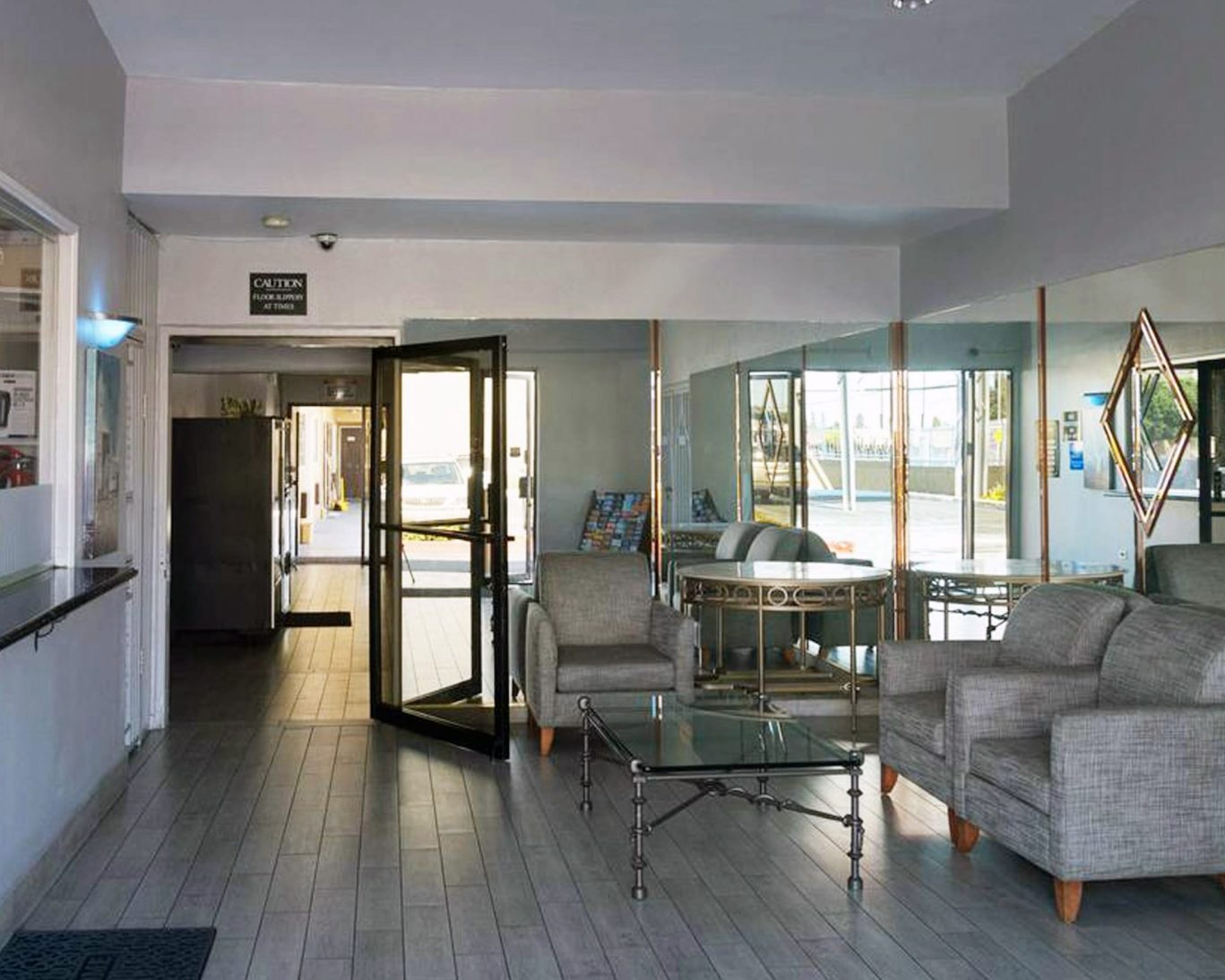 Interior hotel room in Keystone with log furniture and flat-screen TV.