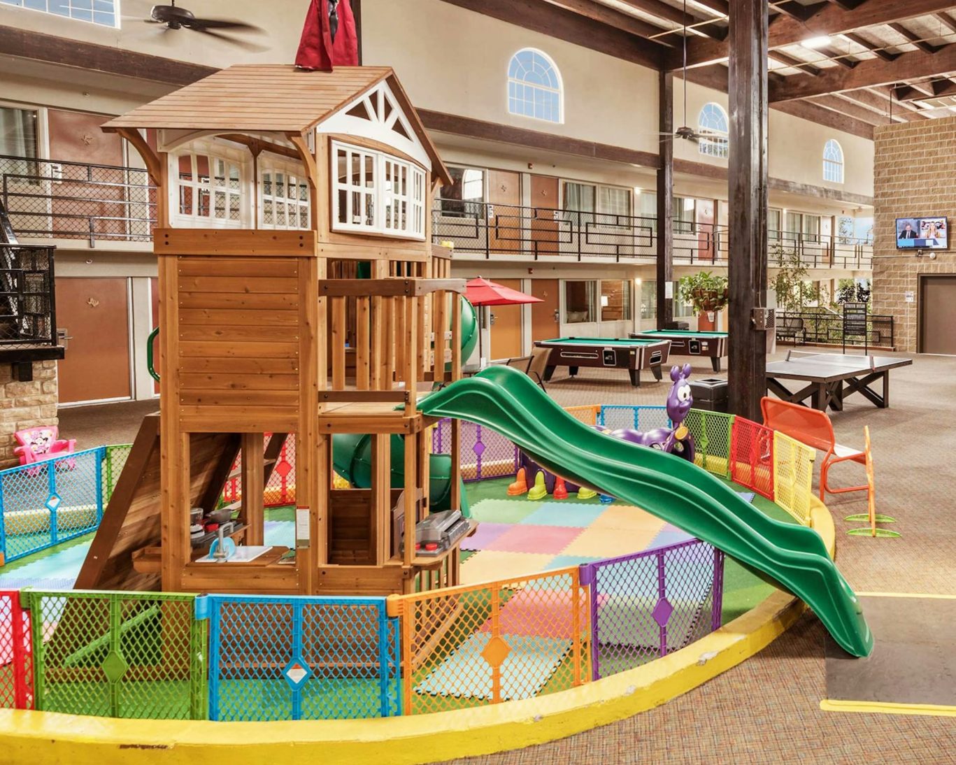 Indoor children’s play area with slides and soft flooring at Pearl on the Concho Hotel, ideal for family-friendly stays in San Angelo.