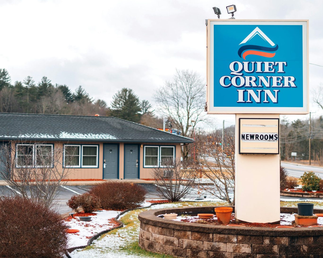 Quiet Corner Inn front signage with guest room exterior in winter, Brooklyn Connecticut motel