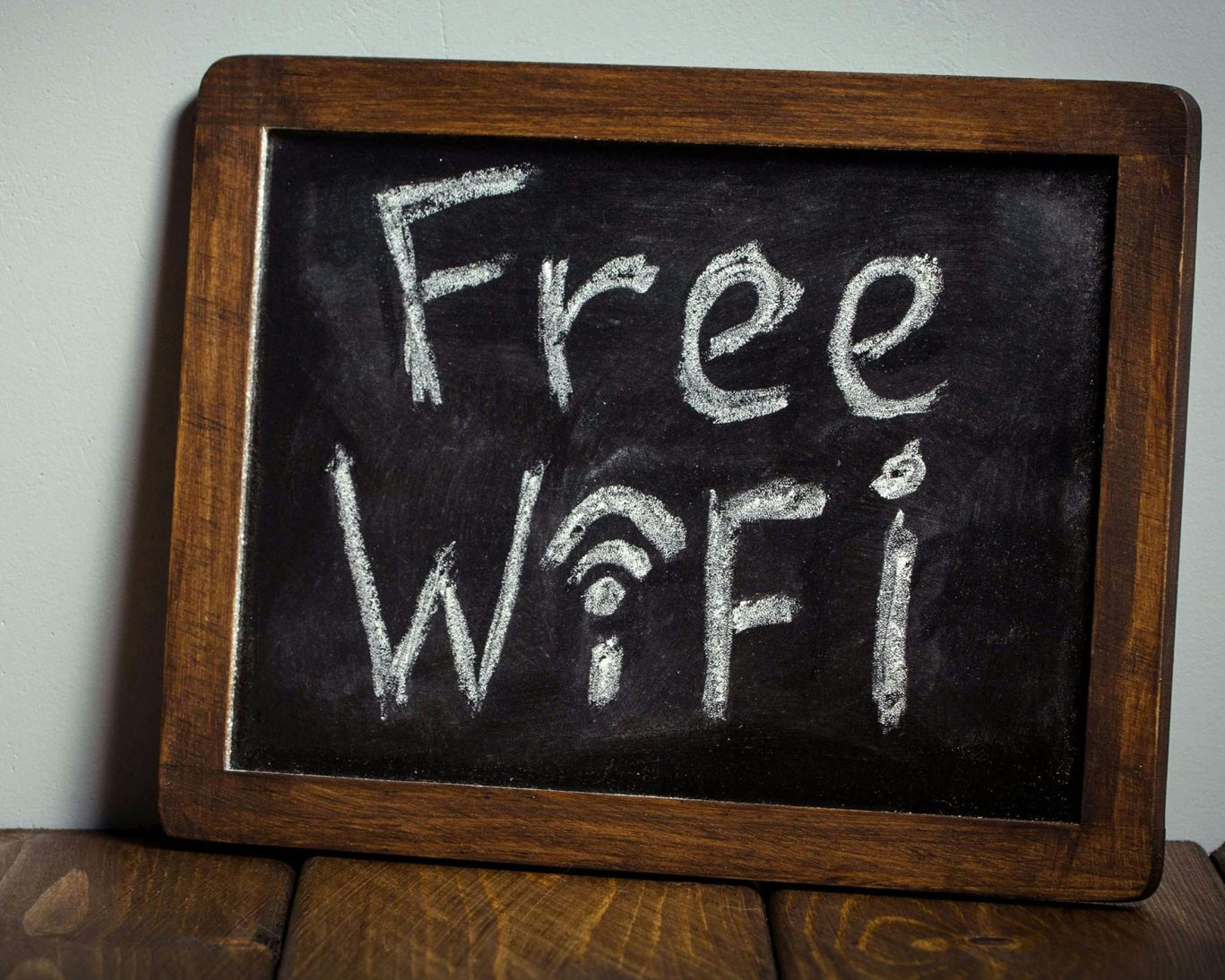 Chalkboard sign advertising free Wi-Fi at Rama Inn Bells for all guests.