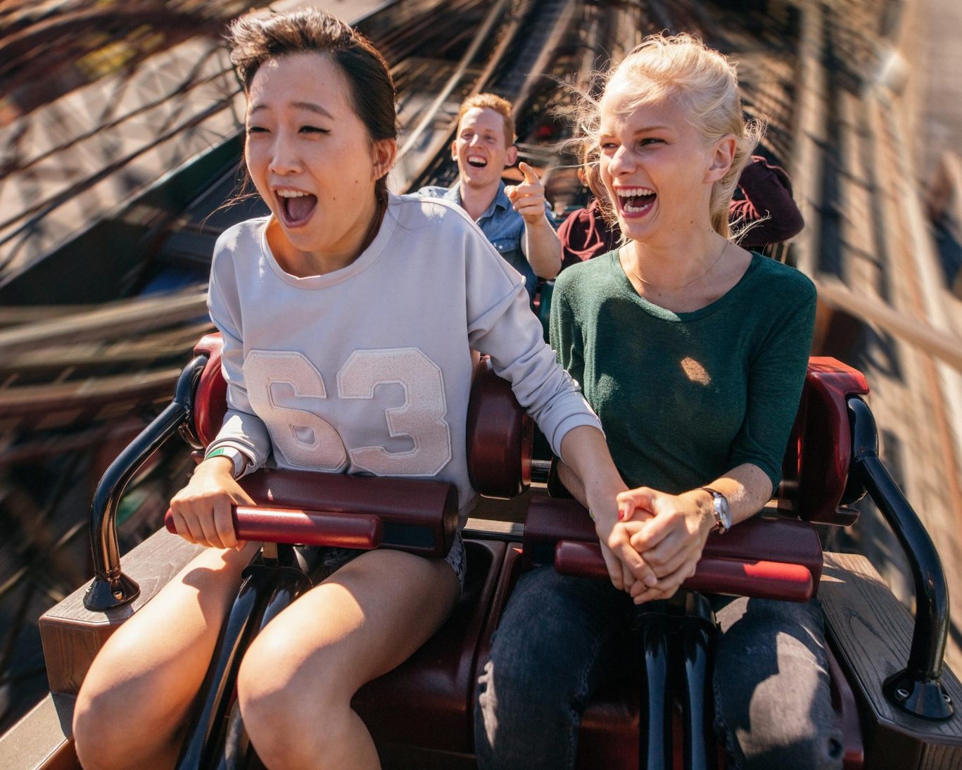 Friends enjoying a thrilling roller coaster ride at Knoebels Amusement Resort in Elysburg, Pennsylvania.