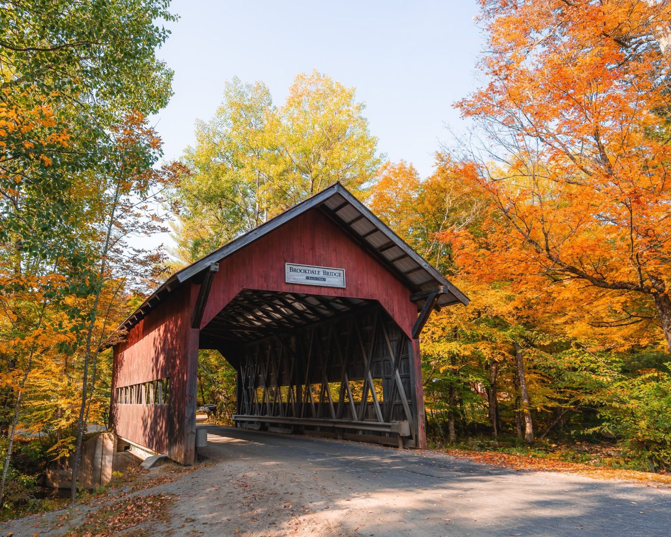 Brookdale Covered Bridge surrounded by vibrant fall foliage near Rockville, Indiana