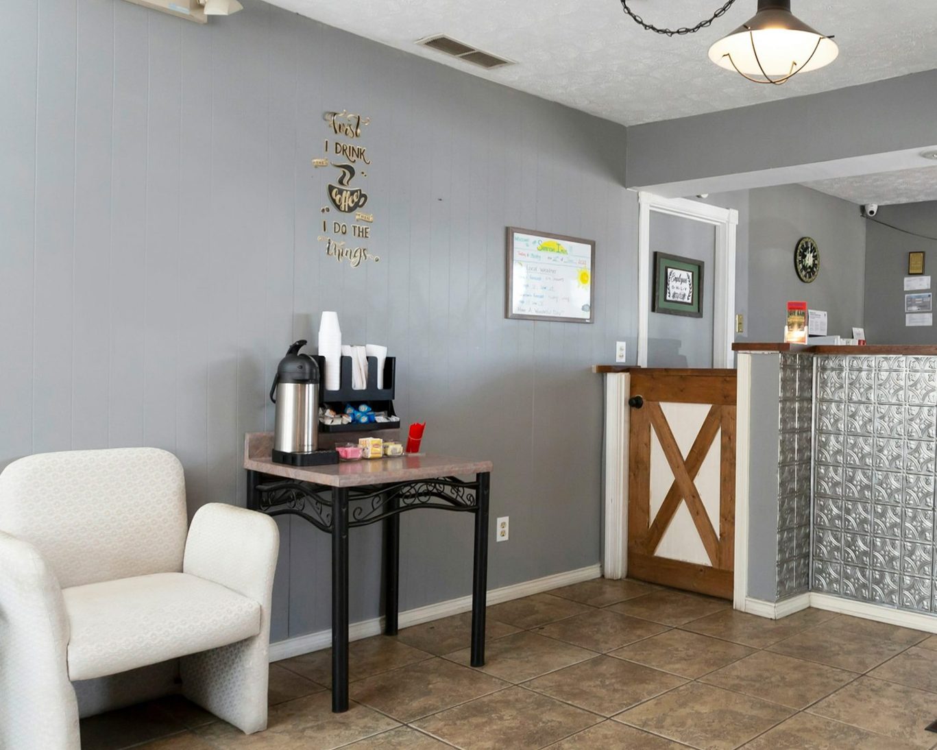 Lobby area with complimentary coffee station and cozy seating at Sunrise Inn Williamstown
