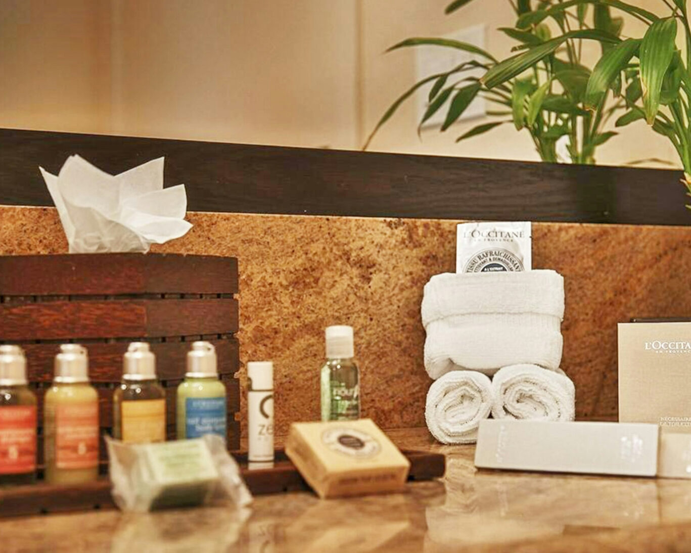 Luxury L’Occitane bath amenities and rolled towels in Zen Hotel Palo Alto bathroom
