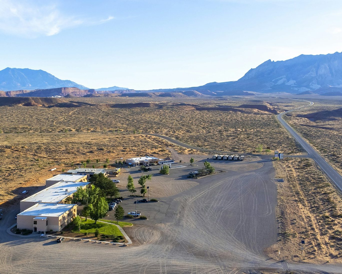 Aerial v.iew of Ticaboo Lodge surrounded by desert landscape and scenic Utah mountains