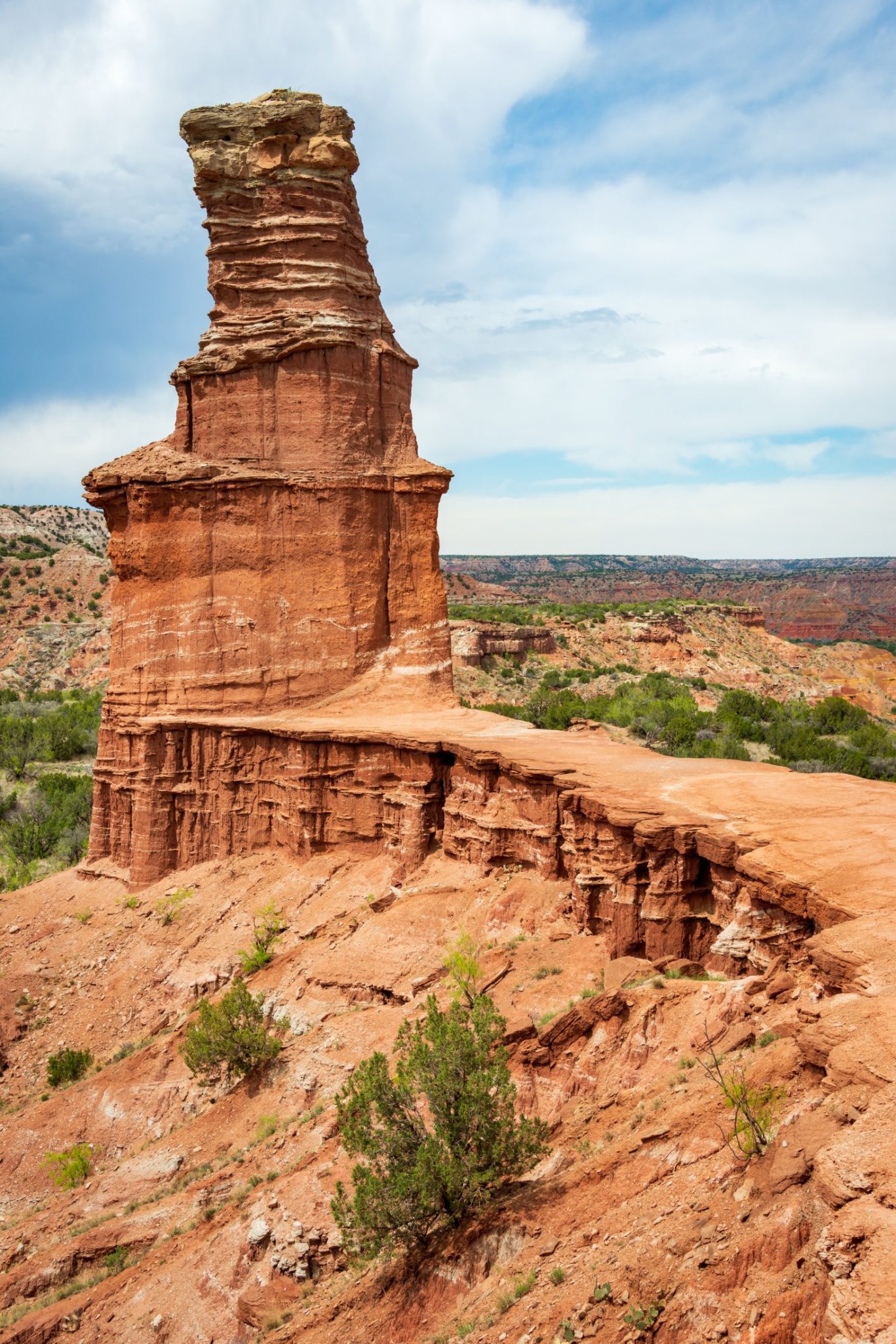 Iconic Lighthouse Rock in Palo Duro Canyon State Park, Texas, with layered red rock cliffs.